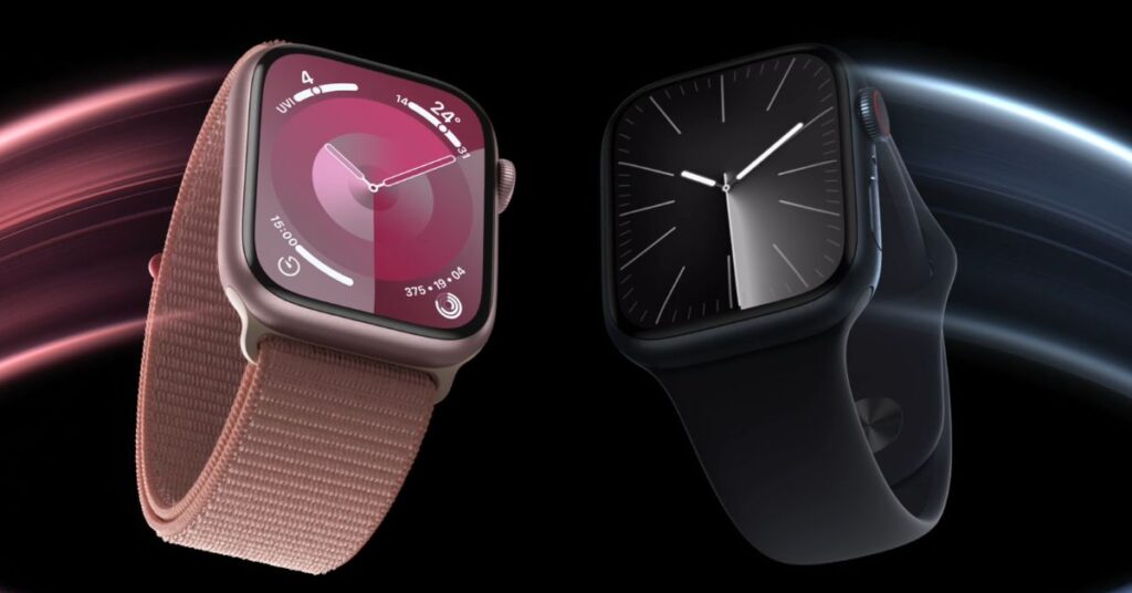 Un smartwatch con un display luminoso e cinturino nero è posizionato su una superficie chiara, mentre sullo sfondo si intravede un ambiente minimalista e moderno.
